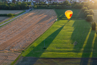 Landing of two hot air balloons "Pfalzgas in Winden in the state Rhineland-Palatinate, Germany out of the air