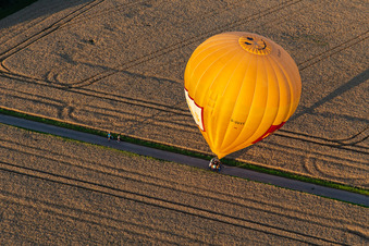 Landing of two hot air balloons "Pfalzgas in Winden in the state Rhineland-Palatinate, Germany viewn from the air