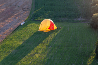 Drone image of Landing of two hot air balloons "Pfalzgas in Winden in the state Rhineland-Palatinate, Germany