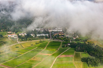 Oblique view of Dense clouds over the Palatinate Hospital for Psychiatry and Neurology in Klingenmünster in the state Rhineland-Palatinate, Germany