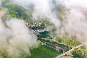 Aerial photograpy of Low clouds over the geothermal power plant Insheim in Insheim in the state Rhineland-Palatinate, Germany