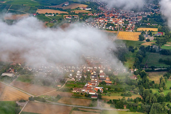 Village hidden under clouds from the east in the district Mühlhofen in Billigheim-Ingenheim in the state Rhineland-Palatinate, Germany
