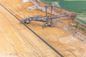 Aerial photograpy of Giant hoisting crane eats into former farmland for the western expansion of the Garzweiler open-cast lignite mine in the district Immerath in Erkelenz in the state North Rhine-Westphalia, Germany