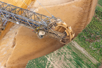 Giant hoisting crane eats into former farmland for the western expansion of the Garzweiler open-cast lignite mine in the district Immerath in Erkelenz in the state North Rhine-Westphalia, Germany out of the air