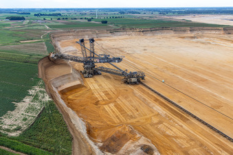 Bird's eye view of Giant hoisting crane eats into former farmland for the western expansion of the Garzweiler open-cast lignite mine in the district Immerath in Erkelenz in the state North Rhine-Westphalia, Germany