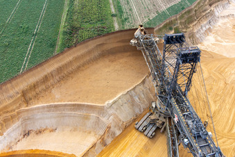 Drone recording of Giant hoisting crane eats into former farmland for the western expansion of the Garzweiler open-cast lignite mine in the district Immerath in Erkelenz in the state North Rhine-Westphalia, Germany
