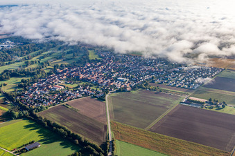 Village on the edge of the clouds in Steinweiler in the state Rhineland-Palatinate, Germany
