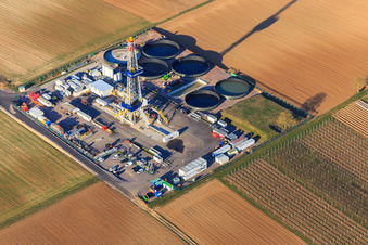 Drilling rig of the V20 deep drilling site of Vulcan Energy at Schleidberg for the extraction of geothermal energy and lithium in Insheim in the state Rhineland-Palatinate, Germany from the drone perspective