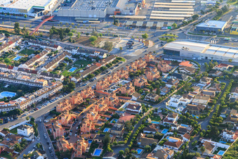 Uniform ochre-colored single-family house development on C. del Paso in Dos Hermanas in the state Seville, Spain