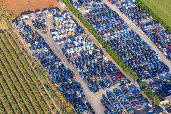 Aerial photograpy of Rows of stacked old vehicles at the Desguace Siglo 21 scrapyard in Dos Hermanas in the state Seville, Spain
