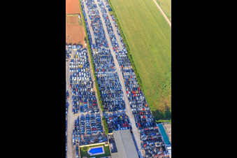 Oblique view of Rows of stacked old vehicles at the Desguace Siglo 21 scrapyard in Dos Hermanas in the state Seville, Spain