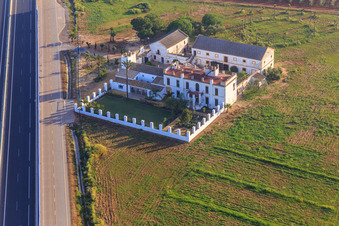Aerial view of Hacienda Menaca between olive tree plantations on the A-4 Autovia del Sur in Dos Hermanas in the state Seville, Spain