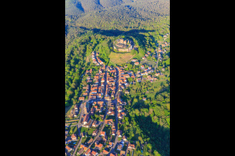 View of the village in the Northern Vosges from the west with the church of Notre-Dame-Marie-Auxilliatrice below the Château de Lichtenberg in Lichtenberg in the state Bas-Rhin, France