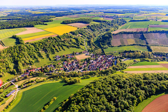 Village overview in the lovely Taubertal with vineyard Tauberzell in the morning from the southwest in the district Tauberzell in Adelshofen in the state Bavaria, Germany