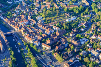 Train station and Tauber Bridge and Church of St. Venantius in Wertheim in the state Baden-Wuerttemberg, Germany