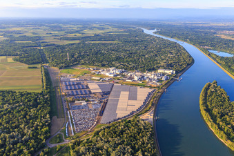 Aerial photograpy of Industrial and Port Zone with industrial facilities on the Rhine belonging to Jungbunzlauer SA and TEREOS Starch & Sweeteners Europe in front of the CEVA Logistics car warehouse in Marckolsheim in the state Bas-Rhin, France