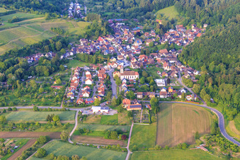 View of the wine-growing village from the west with the church of St. Hilarius in the district Bleichheim in Herbolzheim in the state Baden-Wuerttemberg, Germany