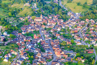 Village view in the Ettenbachtal with Holy Cross Church from the west in the district Münchweier in Ettenheim in the state Baden-Wuerttemberg, Germany