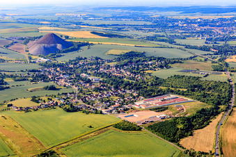 Village view in front of the "Fortschrittschacht" spoil heap from the north in the district Volkstedt in Eisleben in the state Saxony-Anhalt, Germany