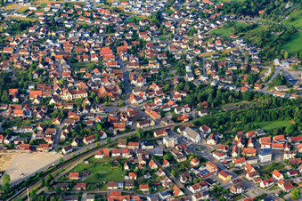 View of the town from the north with Hohenzollernhalle and St. Nicholas Church in the district Steinhofen in Bisingen in the state Baden-Wuerttemberg, Germany