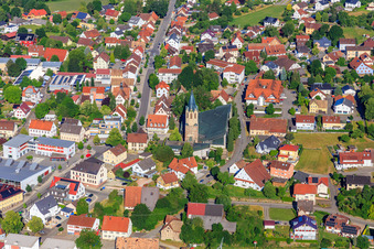 Aerial view of Town center with St. Martinus Church, Wehle sports hall and Volksbank Schwarzwald-Donau-Neckar eG in Dunningen in the state Baden-Wuerttemberg, Germany