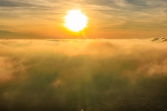 Sunset above the clouds in Steinfeld in the state Rhineland-Palatinate, Germany