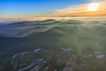 Palatinate Forest and Northern Vosges Mountains in the evening haze in Silz in the state Rhineland-Palatinate, Germany