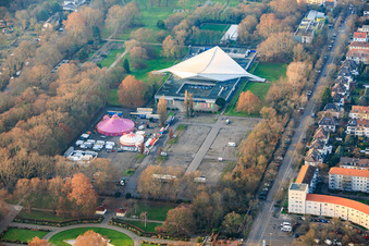 Friedrich-Ebert-Halle and circus in the parking lot at Ebertpark in the district Friesenheim in Ludwigshafen am Rhein in the state Rhineland-Palatinate, Germany
