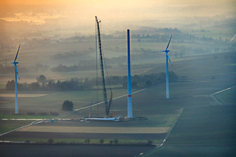 Aerial view of Sunset during the repowering of wind farm Minfeld. JUWI is replacing four old turbines (GE 1.5) from 2004 with two new, modern Vestas V162 turbines, each with a capacity of six MW. in Minfeld in the state Rhineland-Palatinate, Germany