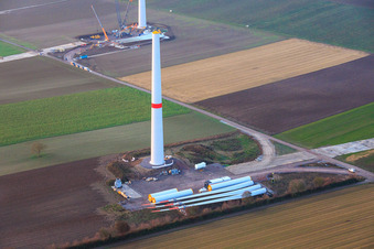 Oblique view of Giant crane for the repowering of the wind farm Minfeld. JUWI is replacing four old turbines (GE 1.5) from 2004 with two new, modern Vestas V162 turbines, each with six MW. in Minfeld in the state Rhineland-Palatinate, Germany