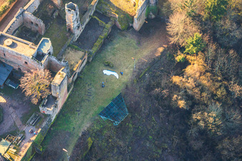 Aerial view of Paraglider pilots preparing for takeoff at the hang-gliding ramp below Madenburg Castle in Eschbach in the state Rhineland-Palatinate, Germany