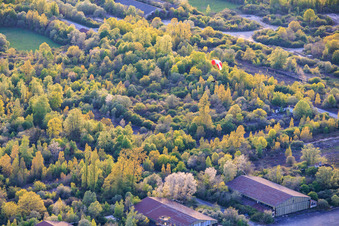 Paragliders over the hangars at the former military airfield Grostenquin in Bistroff in the state Moselle, France