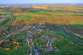 Village view in a bend of the Saar and Canal des Houillères de la Sarre (Saar Canal) in Wittring in the state Moselle, France