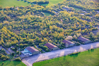 Paragliders over the hangars at the former military airfield Grostenquin in Bistroff in the state Moselle, France
