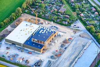 New construction site of the company Benkert Dachbegrünung GmbH & Co. KG between Prappacher Straße and the Godelstatt industrial park for a hall and office building at the Hassfurt allotment garden association. in the district Kleinaugsfeld in Haßfurt in the state Bavaria, Germany