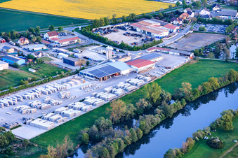 Industrial park on the banks of the Main River with the concrete plant GODELMANN GmbH & Co. KG in Wonfurt in the state Bavaria, Germany