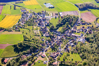 Village view from the west with castle Ditterswind (formerly a nursing home for the mentally disabled run by the Diaconal Association, now the private residence of the Fischer family of entrepreneurs) in the district Ditterswind in Maroldsweisach in the state Bavaria, Germany
