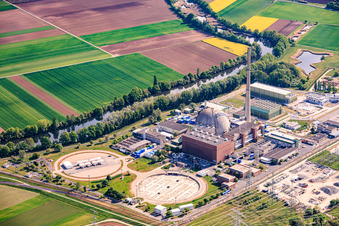 Former cooling towers Grafenrheinfeld at the decommissioned nuclear power plant Grafenrheinfeld of Preussenelektra GmbH on the banks of the Main River with Castor storage in the "gymnasium" in Grafenrheinfeld in the state Bavaria, Germany