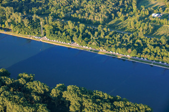 Motorhome parking area on the banks of the Rhine in the district Leopoldshafen in Eggenstein-Leopoldshafen in the state Baden-Wuerttemberg, Germany