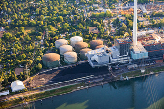 Oil tanks and coal heap of the GKM power plant Mannheim on the Rhine in the district Neckarau in Mannheim in the state Baden-Wuerttemberg, Germany
