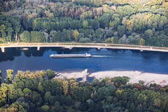 Empty cargo ship at low water on the Rhine between Hördter Rheinaue and Dettenheim in the district Liedolsheim in Dettenheim in the state Baden-Wuerttemberg, Germany