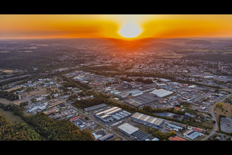 Sunset over the industrial area in the district Zone Industrielle du Grand Bois Fayencerie in Saargemünd in the state Moselle, France