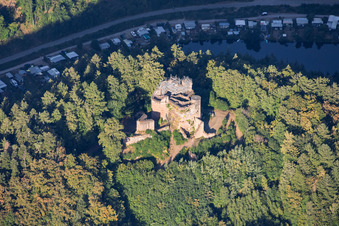 Neudahn castle ruins (scaffolded for renovation) overlooking the Neudahn Pond in Dahn in the state Rhineland-Palatinate, Germany
