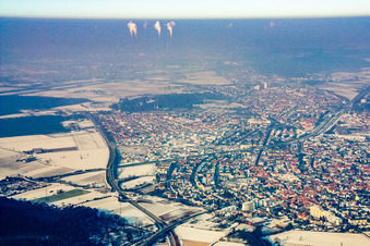 View of the town from the east under wintry high fog with snow in Oftersheim in the state Baden-Wuerttemberg, Germany