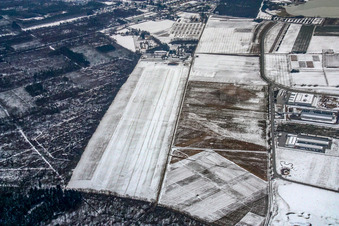 Wintry snowy Gliding field on the airfield of Segelfluggelaende Rheinstetten in Rheinstetten in the state Baden-Wurttemberg, Germany