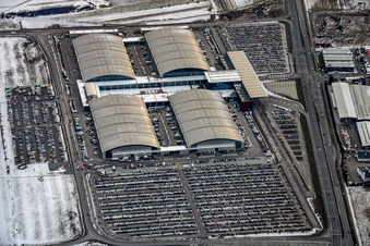 Wintry snowy Exhibition grounds and exhibition halls of the DM-Arena Karlsruher Messe- and Kongress GmbH in the district Forchheim in Rheinstetten in the state Baden-Wurttemberg, Germany