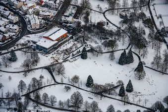 Wintry snowy Park of Kurpark with Herzog Kaffee in Reichenbach in the state Baden-Wurttemberg, Germany