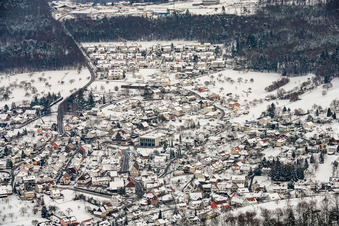 View of the town from the west on the edge of the Black Forest in winter with snow in the district Schwann in Straubenhardt in the state Baden-Wuerttemberg, Germany