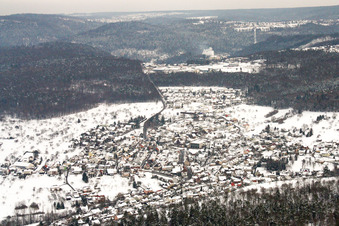 Wintry snowy Village - view on the edge of agricultural fields and farmland in Birkenfeld in the state Baden-Wurttemberg, Germany