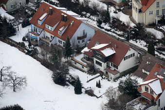 Oblique view of Mühlgasse in winter with snow in the district Gräfenhausen in Birkenfeld in the state Baden-Wuerttemberg, Germany